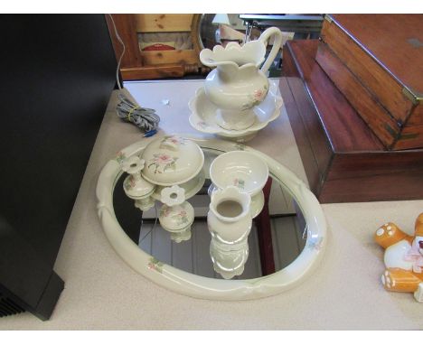 A ceramic bathroom mirror with matching wash bowl and jug, candlesticks of squat form, etc