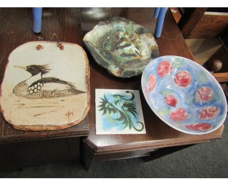 A small collection of studio pottery including bird design wall plaque, 30cm x 25cm, Celtic pottery tile, 15.5cm x 15.5cm and