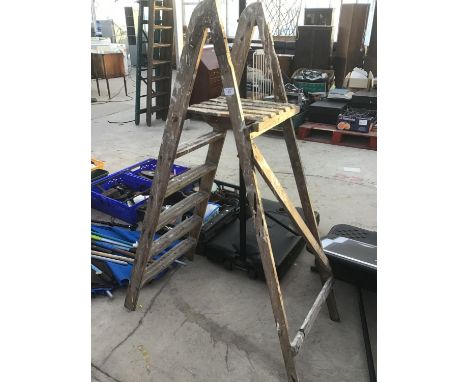 A SET OF VINTAGE WOODEN FIVE STEP LADDERS 