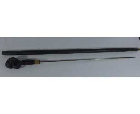 AN AFRICAN SWORD STICK WITH CARVED WOODEN HEAD, 56 CM BLADE 