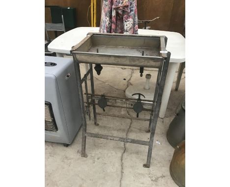 A VINTAGE BOTTLING STAND 