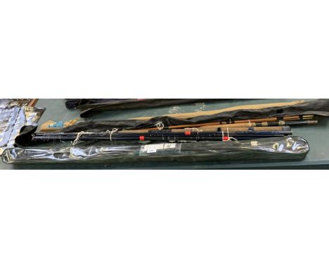 A COLLECTION OF EIGHT CASED FISHING RODS TO INCLUDE ONE CANE ROD, ONE EDGAR SEALEY ROD, ONE SHAKESPEARE UGLE STICK SPIN ROD (