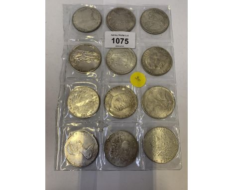 A COLLECTION OF TWELVE VINTAGE COINS 