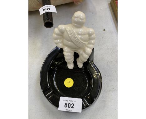 A CERAMIC MICHELIN MAN ASHTRAY 