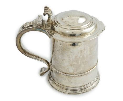 A late Queen Anne Britannia standard silver tankard, maker R?, with banded girdle, hinged domed cover and scroll thumbpiece, 