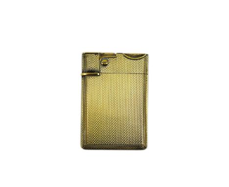 An Elizabeth II Asprey &amp; Co engine turned silver gilt 'wafer' lighter, London, 1967, 56mm.  Some mild wear to the gilding