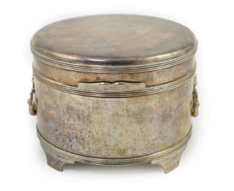 A George V silver circular two handed biscuit box, with hinged cover, by Asprey &amp; Co Ltd, on four feet, London, 1912, dia