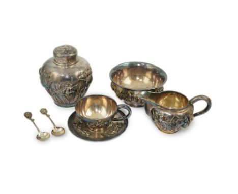 An early 20th century Japanese Meiji period planished silver matched? part tea set comprising a tea caddy with covers, sugar 