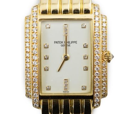 A lady's late 1990's 18ct gold and diamond set Patek Philippe Gondolo quartz wrist watch, on an 18ct gold Patek Philippe brac