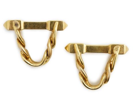 A pair of 18K yellow gold stirrup cufflinks, by Boucheron, (signed and numbered 26504), of twisted curblink and baton design,