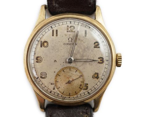 A gentleman's early 1940's 9ct gold Omega manual wind wrist watch, with Arabic dial and subsidiary seconds, movement c.30T2, 