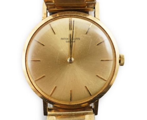 A gentleman's 18ct gold Patek Philippe wrist watch, with yellow dial and baton numerals, case diameter 34mm, gross weight 53.