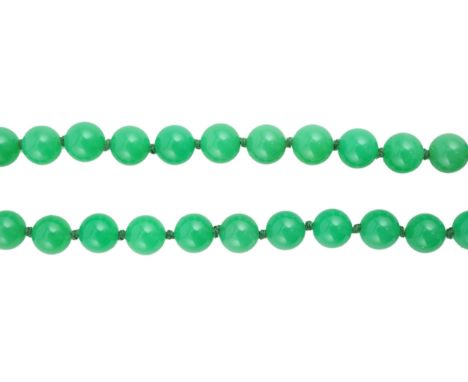 A modern long single strand jadeite bead necklace, with a cabochon jade and diamond chip cluster set 18k clasp, 138cm.  Overa