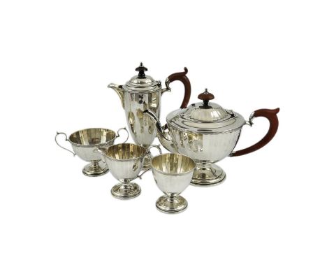 A George V panelled silver five piece tea set by Adie Brothers, of circular pedestal form, Birmingham, 1925/26, gross weight 