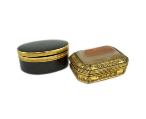 An early 19th century German gold mounted rutile agate? oval snuff box, 64mm and another gilt copper mounted agate snuff box.