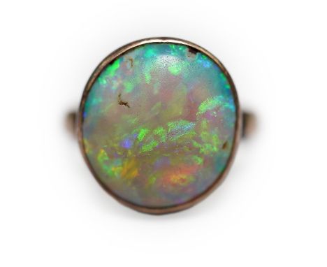 A 9ct gold opal dress ring, size J, gross weight 4.1 grams.  Numerous surface scratches and abrasions to the surface of the o