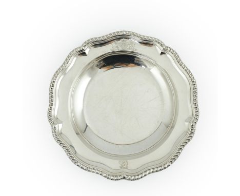 A George IV silver soup plate, by William Eaton, of shaped circular form, with engraved initials and crest, London, 1825, 25c