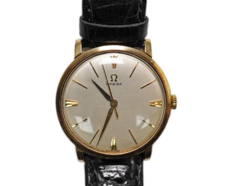 A gentleman's late 1950's 9ct gold Omega manual wind wrist watch, with baton numerals, movement c.520, case diameter 34mm, on