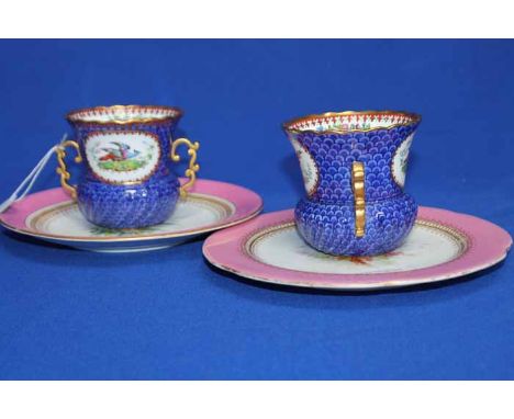 TWO COPELAND SPODE PAINTED VASES
decorated in Chinese style with a pheasant in a carouche, gilt rim, twin gilt foliate handle