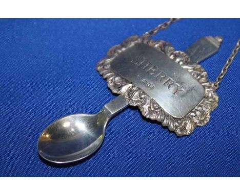 EARLY GEORG JENSEN SILVER PYRAMID PATTERN TEASPOON
together with a pressed silver sherry decanter label (2)