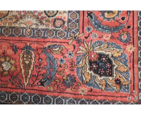 LARGE EASTERN CARPET
decorated with stylised lozenge and foliate motifs, 364cm long 