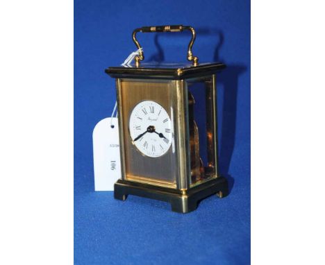 CARRIAGE CLOCK
contained in a brass and glazed case