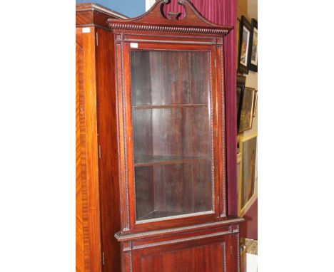 MAHOGANY TWO-STAGE CORNER CABINET
the swan neck pediment with glazed door, over one cupboard and on bracket feet, 205cm high 