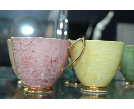 ROYAL ALBERT 'GOSSAMER' TEA SERVICE
comprising six cups, six saucers and six side plates, each with marbled pattern in pink, 