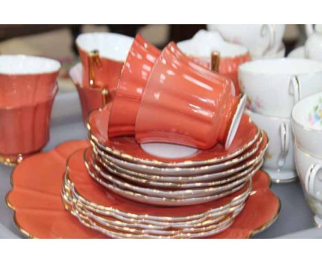 TWO TEA SETS
including a fluted terracotta coloured 'Regency' set and a floral Paragon set, both with six cups and saucers