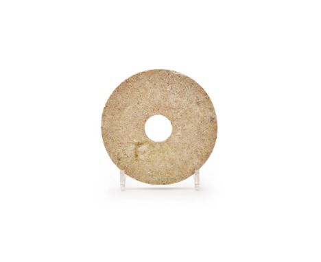 A Chinese carved jade bi disc, Neolithic period, circa 2300-1500 BC, 16.7cm diameter新石器時期 玉璧  Condition Report:  chipped to t