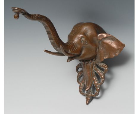 An early 20th century bronze novelty lamp bracket, cast as the head of an elephant, 23cm to tip of trunk 