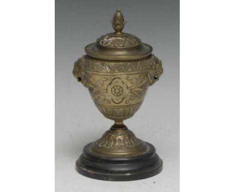 A 19th century French bronze urnular desk inkwell, hinged cover with bud finial, lion masks to sides, turned black marble bas