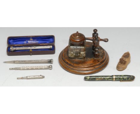 A 19th century silver coloured metal combination propelling pencil and pen, chased and engraved with scrolling foliage, seal 