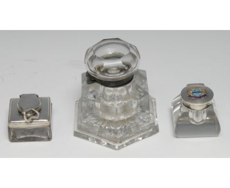 A Victorian clear glass hexagonal desk inkwell, hinged cover, star-moulded base, 10.5cm high, c.1880; a 19th century travelli