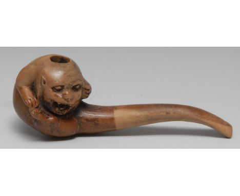Smoking - a briar pipe, carved as a grotesque fanciful beast, 18cm long 