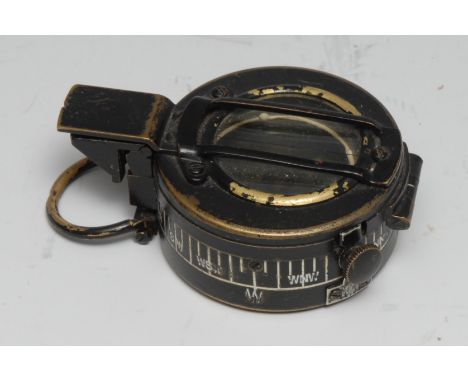 A World War II marching compass, MK.III by TG &amp; Co, London, marked NB 308924, broad arrow mark, dated 1944 