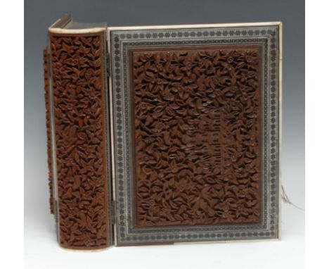 Photography - a 19th century Indian sandalwood and sadeli marquetry photograph album, carved with architectural views amongst