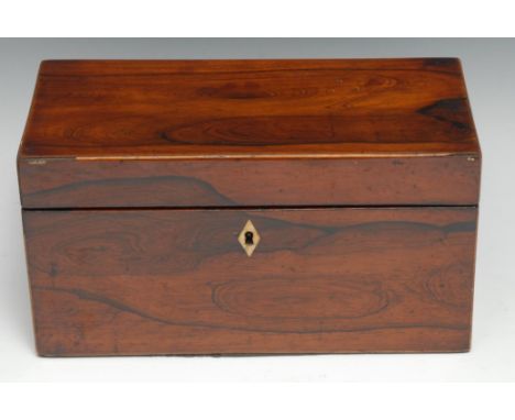 A George IV rosewood rectangular tea caddy, hinged cover enclosing a bowl aperture and a pair of lidded compartments, 27cm wi
