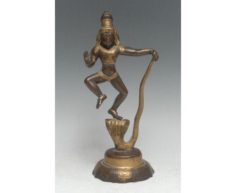 Indian School (19th century), a parcel-gilt bronze murti, Shiva and Vasuki, lotus base, 25cm high 