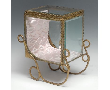 A Continental gilt brass novelty table top bijouterie display cabinet, as a carriage sled, 26.5cm high, mid-20th century 