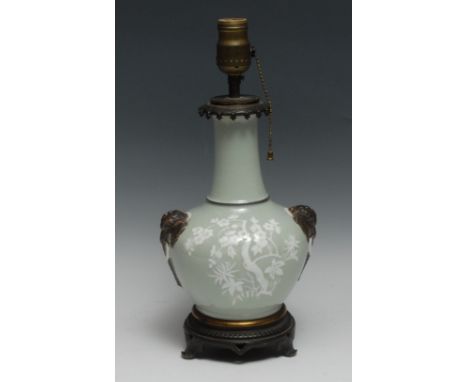 A late 19th century French bottle vase, mounted as an electric table lamp, decorated in the Chinese taste in bianco sopra bia