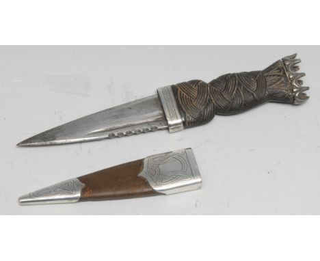 A George V Scottish silver mounted sgian dubh, 9cm blade, crown pommel, leather scabbard, 18.5cm long, Edinburgh 1929 