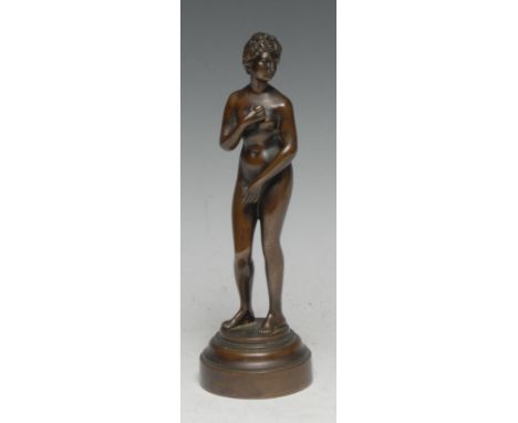 Grand Tour School (19th/early 20th century) a brown patinated bronze, Venus Bathing, circular base, 17cm high 