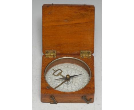 An early 20th century mahogany travelling pocket compass, hinged cover, the needle locking for transit, 6.5cm wide 