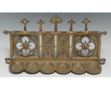 A 19th century Gothic Revival wall mounted six-section smoking room pipe rack, cast with tracery, poppy head trefoils and all