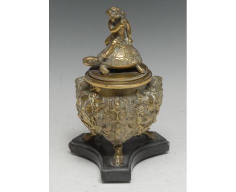 A 19th century Grand Tour bronze inkwell, cast after the Renaissance manner with Bacchic masks and fruiting vine, the cover s