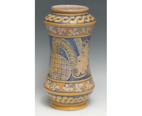 A South European maiolica albarello drug jar, painted with a Chinese figure, meandering leafy stems and guilloche, 31.5cm hig