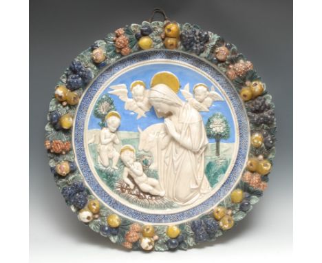 An Italian maiolica roundel, after Luca Della Robbia, The Madonna Del Presepio, 58cm diam 