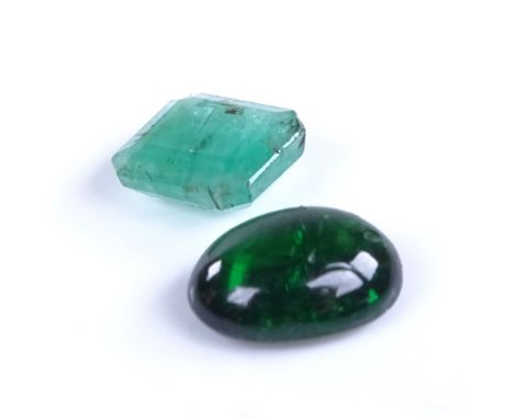 2 loose emerald gemstones, comprising emerald step-cut (6.33mm x 5.67mm x 2.82mm), and cabochon example (7.87mm x 5.98mm x 3.