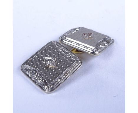A single 14ct gold diamond set cufflink, engine turned decoration, maker's marks TH, panel length 13.5mm, 5.2gGood original c